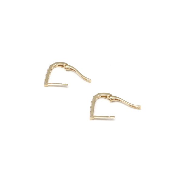 Aretes articulados con circonias en oro amarillo 14 kilates. Online now