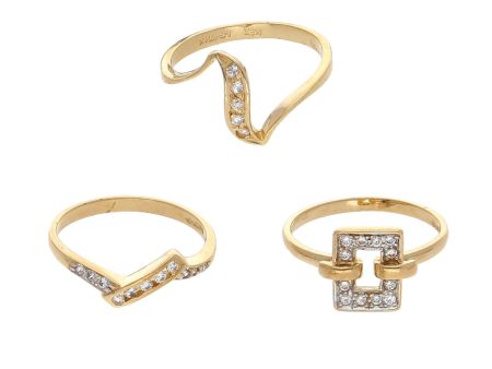 Tres anillos estilizados con circonias en oro amarillo 14 kilates. Discount